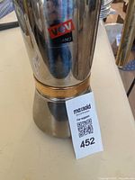 Front view of Vev Vigano espresso machine showing full body with logo and metal finish