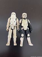 Photo of two Star Wars figures, a Gen 2 Snowtrooper and a Gen 3 Scout Trooper, showing front view and details of armor and helmet.
