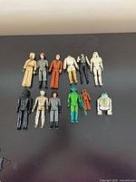 Full lot of original Star Wars Generation 1 figures displayed on black surface.