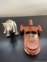 Photo of the Star Wars X-43 Landspeeder vehicle and Tauntaun figure side by side on a table