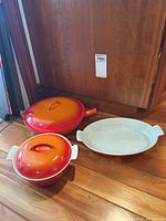 Overview of three pieces: small Dutch oven, sauté pan, oval baker