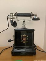 Front view showing black enamel cabinet and decorative Jydsk crest