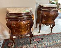 Two matching bombe style cabinets side by side