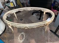 Angled front view showing overall table frame and missing glass top