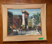 Full image of the framed painting showing the street scene and frame condition.