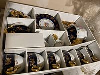 Full set in original packaging showing all pieces including teapot, creamer, sugar bowl, cups and saucers