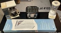 Lot overview with vintage coffee pot, toaster, blender, and boxed clothes closet organizer on table