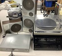 Photo showing entire electronics lot with karaoke system, speakers, DVD player, stereo receiver, and turntable with dust cover.