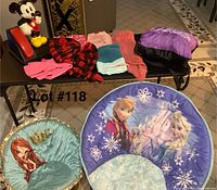 Lot contents showing Mickey Mouse phone, two children's chairs, inflatable chair with Frozen theme, and multiple dog sweaters in various colors