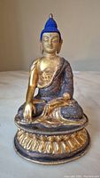 Front overall view of Brass Buddha statue