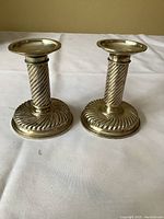 Front view of both candlesticks upright
