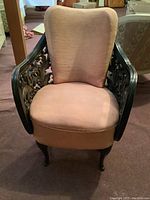 Front full view of chair showing overall shape, upholstery and frame