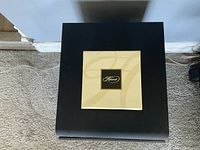 Top view photo of the black Herend branded box lid.