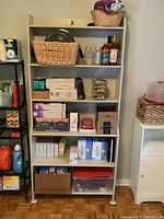Front view of tall wood pantry shelf with five shelves. Various pantry items visible for scale, but contents not included.