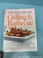 Front cover of 'The Best Recipe Grilling & Barbecue' cookbook showing grilled shrimp on a white plate.