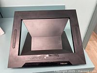 Front view of the black rectangular Fellowes adjustable laptop/tablet stand surface showing a windowed frame area to hold device.