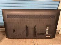 Rear view showing mounting brackets, vents and wear marks