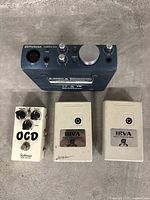 Top view of all four items arranged on a flat surface, showing the Presonus AudioBox interface, Fulltone OCD pedal, and two IBVA devices