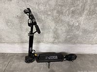 Side view of EVQLV electric scooter showing folding handlebar and deck