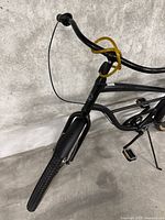 Front steering view showing matte black frame, front fork and handlebar