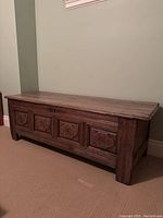 Front view of chest showing carved panel details