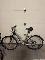 Side view of the full ladies Trek bike showing frame, tires, seat, and handlebars.