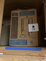 Original box of the Regal stainless steel automatic coffee maker showing branding and capacity details (12 to 40 cups).