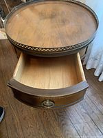 View of the open drawer showing interior and metal edged top with heart cutouts