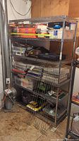 Full view of metal shelving unit containing various stored items, showing size and structure.