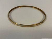 Top-down view of the bangle laid flat on a white surface