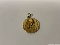 Front side showing relief of the Virgin Mary