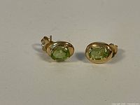 Front view of both stud earrings displayed side by side.