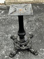 Front angle view of entire cast iron table base