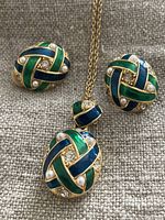 Front view of the gold-tone necklace pendant and matching clip-on earrings showing green and blue enamel with faux pearls and rhinestones.