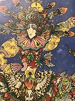 Close-up of central figure and strawberry motifs in the print.