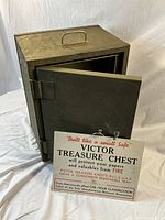 Victor Treasure Chest small metal safe open showing interior and removable tray with sign describing product