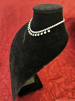 Front and side views of the vintage sterling silver choker necklace adorned with cubic zirconia stones.