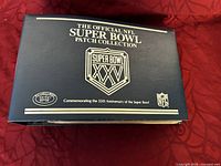 Front cover of the official NFL Super Bowl Patch Collection book in dark blue with white lettering and NFL logos.