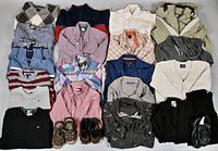 Top down view showing all clothing pieces laid out in rows including shirts, knit sweaters, jackets, pants, shoes and accessories.