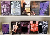 Photo of 10 romance novels by Delilah Devlin and Jasmine Haynes arranged in two rows.