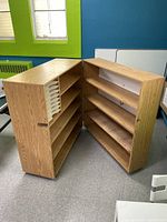 Open shelving unit showing interior shelves and paper sorter.