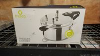 Boxed Fresco brand pressure cooker showing front of the packaging with product image and label indicating 5 liters capacity.