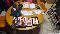 Full lot items arranged on table including wigs, lingerie sets, panties, and costumes.