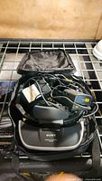 Sony Glasstron headset with cables and remote inside carrying case, seen from top.