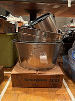 Stacked hammered aluminum ice buckets and drink tub on original Georgian Libbey glasses box