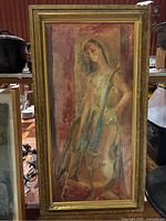 Full view of the large framed painting showing the female figure with cello against a warm-toned abstract background in a gold decorative frame.