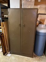 Closed brown metal cabinet showing its exterior condition