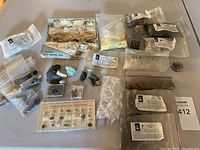 Top view of multiple labeled mineral sample bags, educational card, Arizona rock-mineral map, and loose specimens.