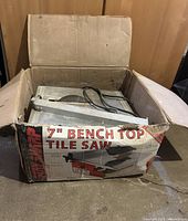 7 inch Stay Sharp tile saw in original cardboard box showing front and side of box