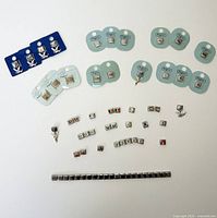 Full layout of Italian charm bracelet and assorted Pugster charms including packaged and loose square links